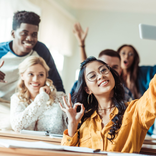 group-of-multiethnic-students-taking-selfie-in-cla-2023-11-27-05-07-38-utc-2-scaled