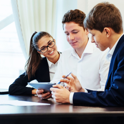 vecteezy_group-of-students-studying-using-a-laptop_6858383-1-scaled