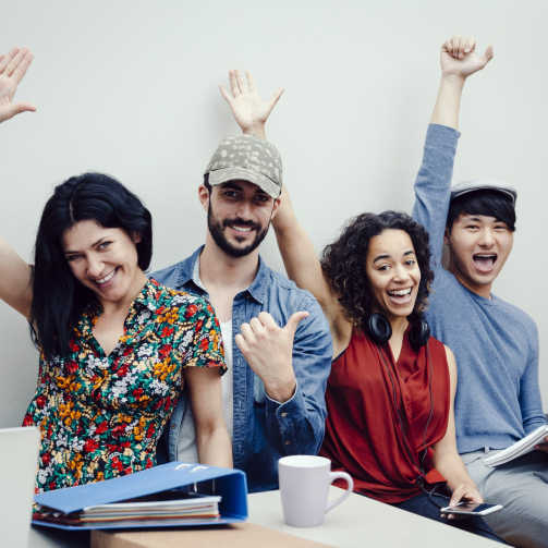 group-of-four-multiethnic-entrepreneurs-celebratin-2024-12-07-12-52-07-utc-scaled