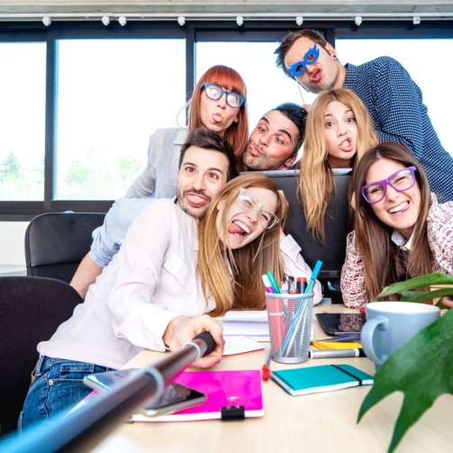 young-people-employee-workers-taking-happy-selfie-2024-07-03-02-44-12-utc-scaled (1)