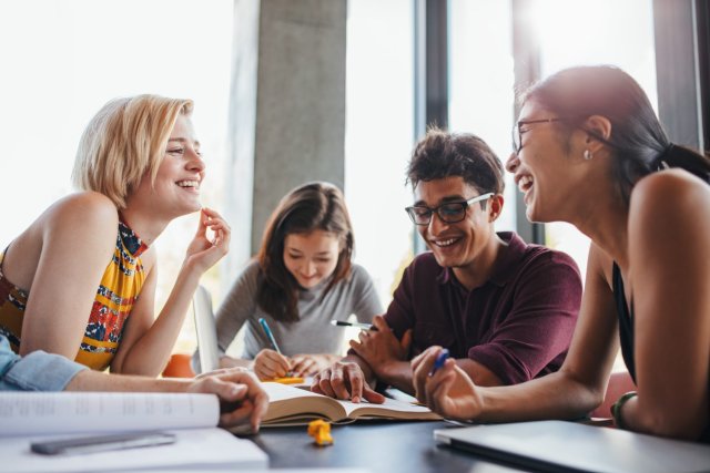International students joyfully participating in an English communication class at a renowned language center in Malaysia