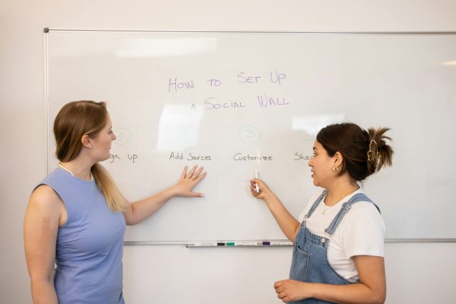 Students practicing English speaking skills in a classroom at VI Academy